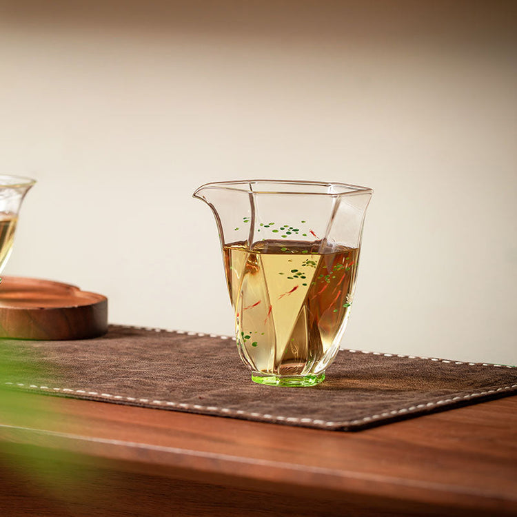 Hand-painted glass fair cup with amber tea