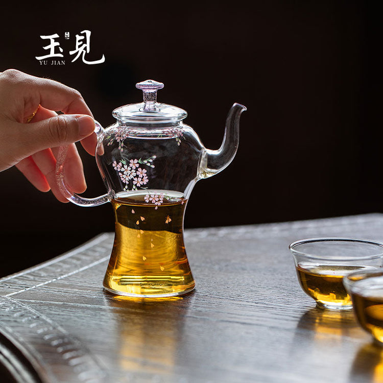 Hand-painted cherry blossom glass gongfu teapot pouring amber tea