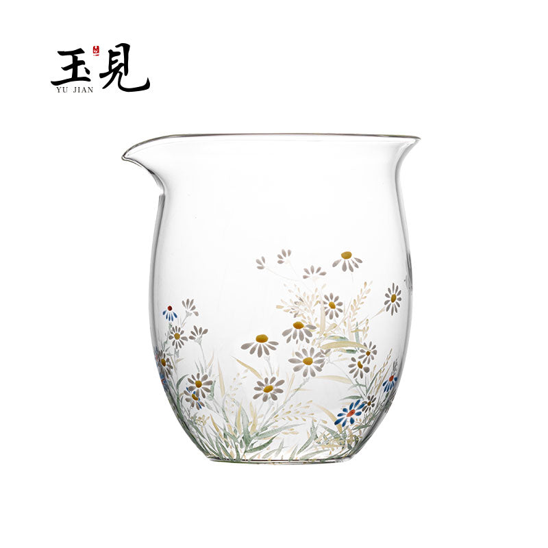 Hand-painted floral glass tea pitcher with scattered daisies and small blue floral accents.