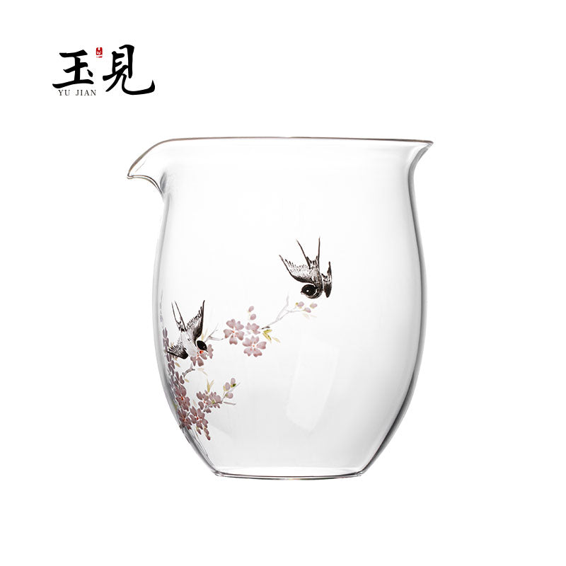 Hand-painted floral glass tea pitcher with small bird silhouettes and pink blossom details.